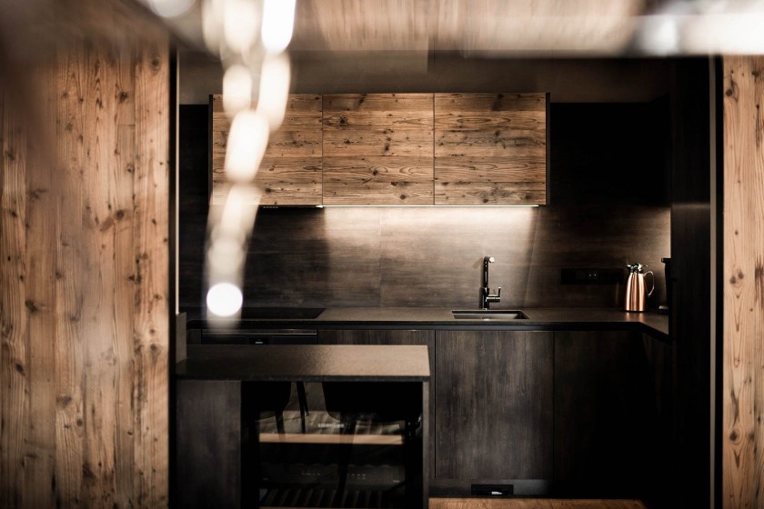 Designer kitchen made of wood with high-quality appliances