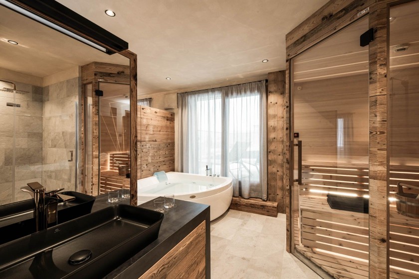 Large bathroom with spacious bathtub and private sauna
