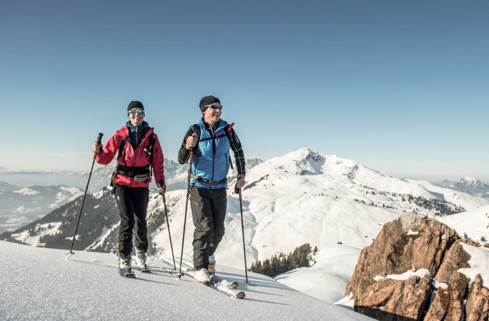Cross-country skiing surrounded by snow-covered mountain landscapes