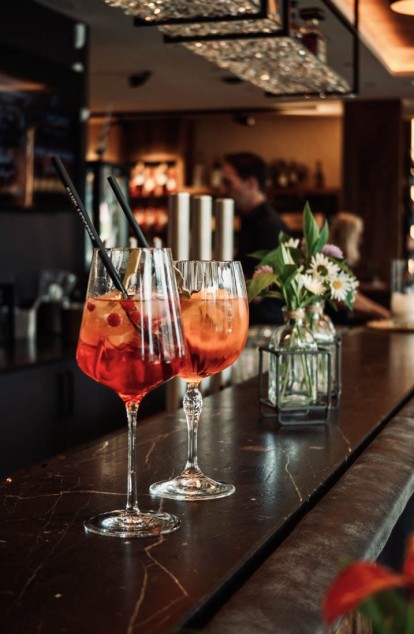 Enjoy cocktails at the bar